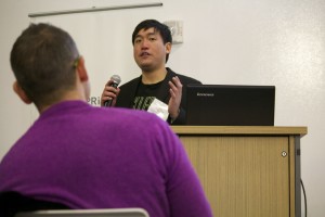 Entrepreneur pitching to a full room